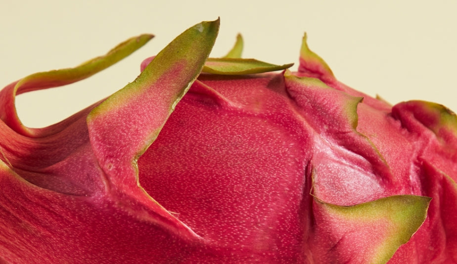 red dragon fruit and white dragon fruit are sliced and separated into two plates