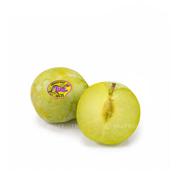 Premium Emerald Beaut green plums from California with smooth pale green skin and PLU #4435 stickers displayed on a white background.