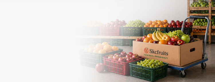 Cart with a box of SKC Fruits and vegetables on wholesale bulk baskets on the floor.