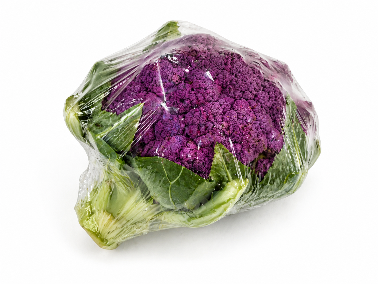 Purple cauliflower wrapped in plastic on a white background