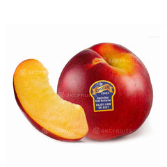 Cut open Chosen One Gold Nectarine showing golden yellow flesh