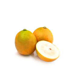 Close-up of CNY Gold Wrapped Honey Kumquats showing sweet peel and bright juicy flesh
