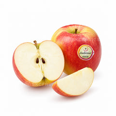 Ambrosia Apple cut open showing juicy crisp flesh Mela Ambrosia Apple with distinctive red blush and yellow base