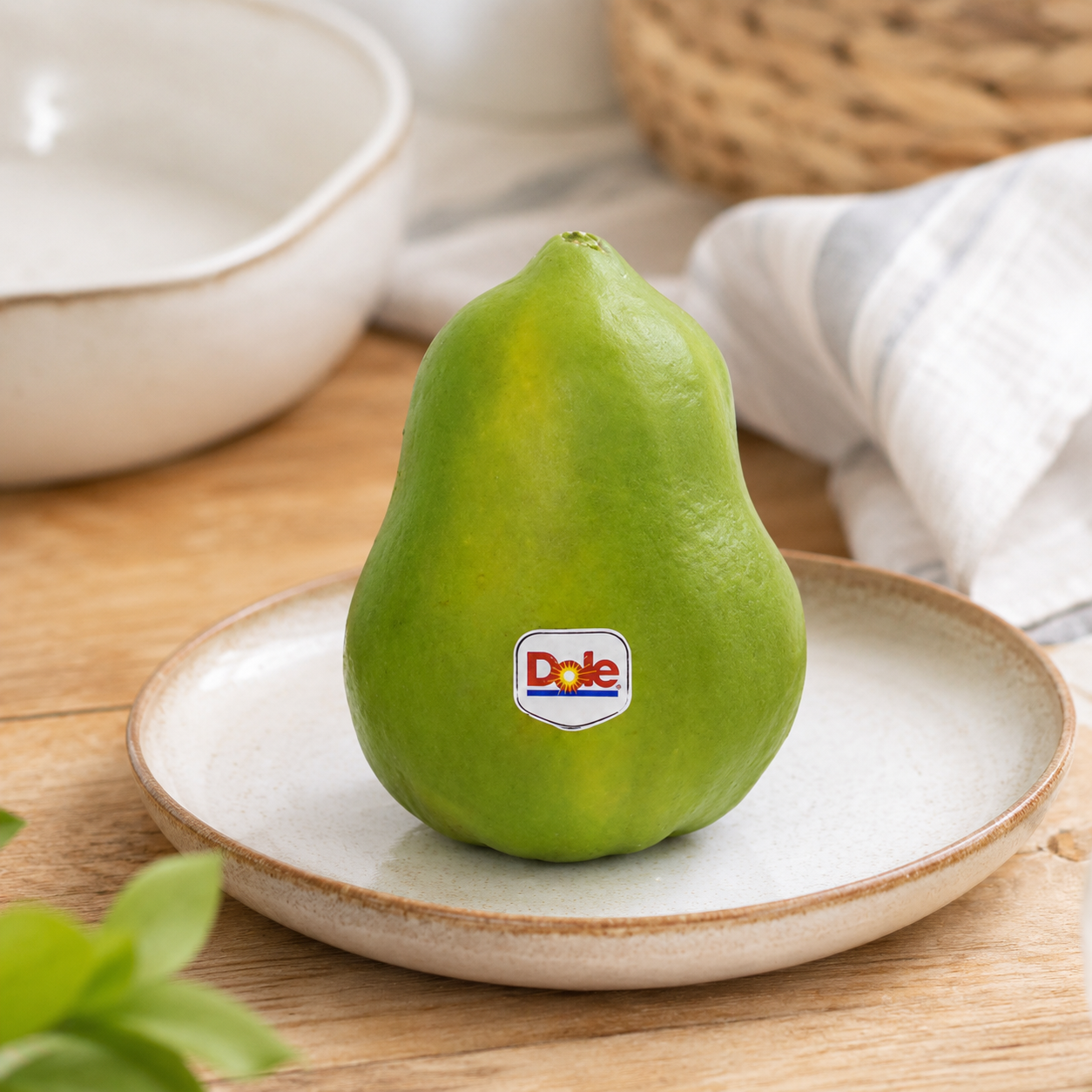 Cut open Dole Papaya showing orange-red flesh and black seeds