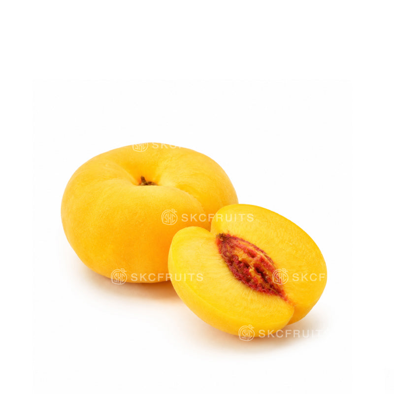 Flat peach also known as donut peach with pale yellow skin