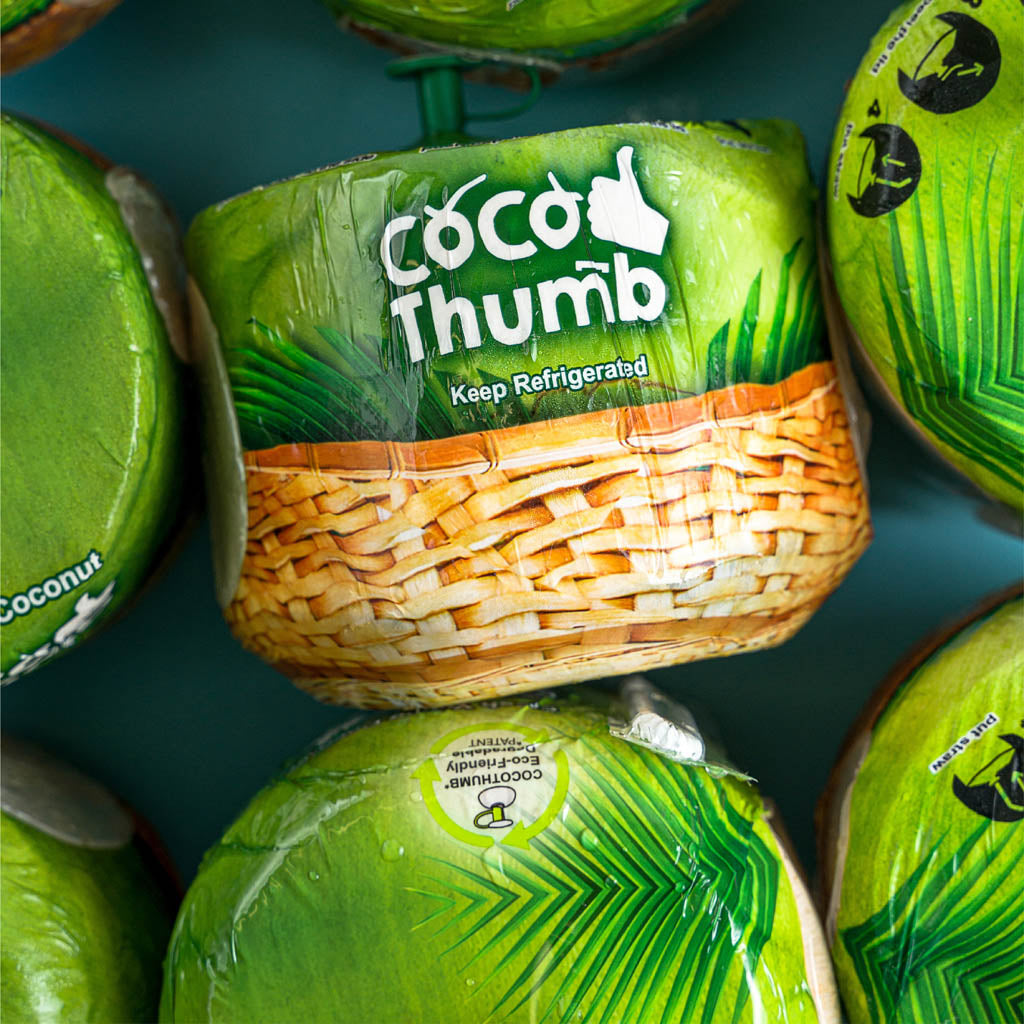 Fresh coconut water in Coco Thumb young Thai coconut
