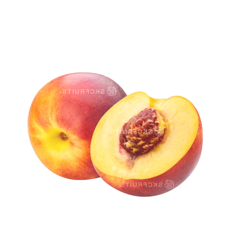 Cut open Gold Nectarine showing golden yellow flesh and centre stone