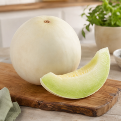 Green melon honeydew slices served chilled on a plate