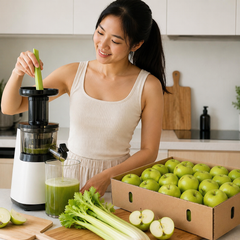 Singaporean juicing fresh Granny Smith green apple slices and celery in Singapore for a healthy lifestyle