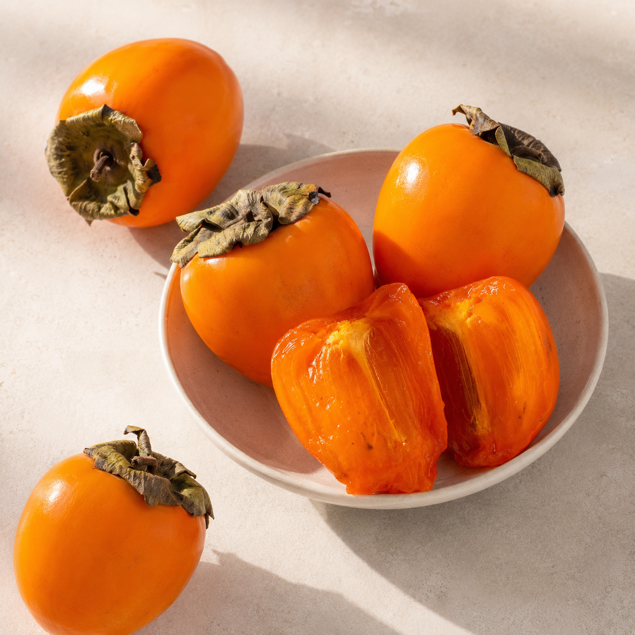 Hachiya vs Fuyu persimmon comparison showing soft astringent persimmon style