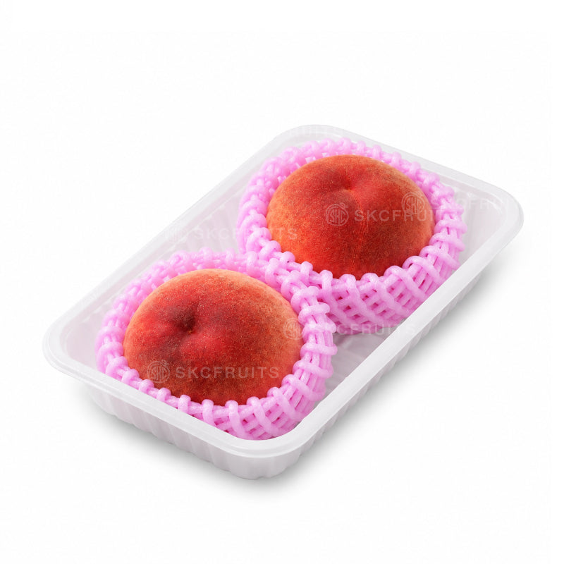 Japanese peach packed by SKC Fruits in clear tray