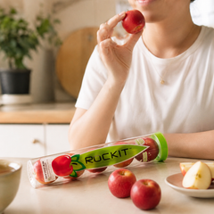 Office CBD workers sharing and eating a tube of Mini Rockit apples snack pack