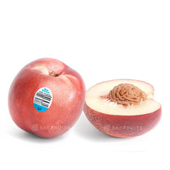 Cut open Australian nectarine showing juicy stone fruit flesh