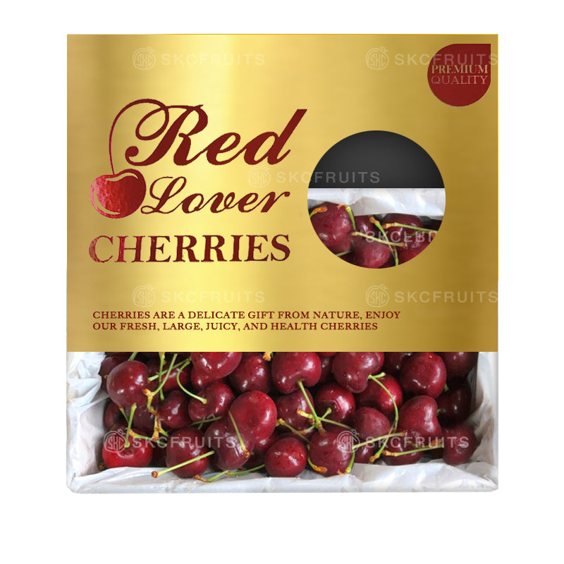 Packaging of Red Lover Cherries showing the cherries inside a transparent plastic bag with a gold and red label, and a small inset image of cherries on the top right corner.