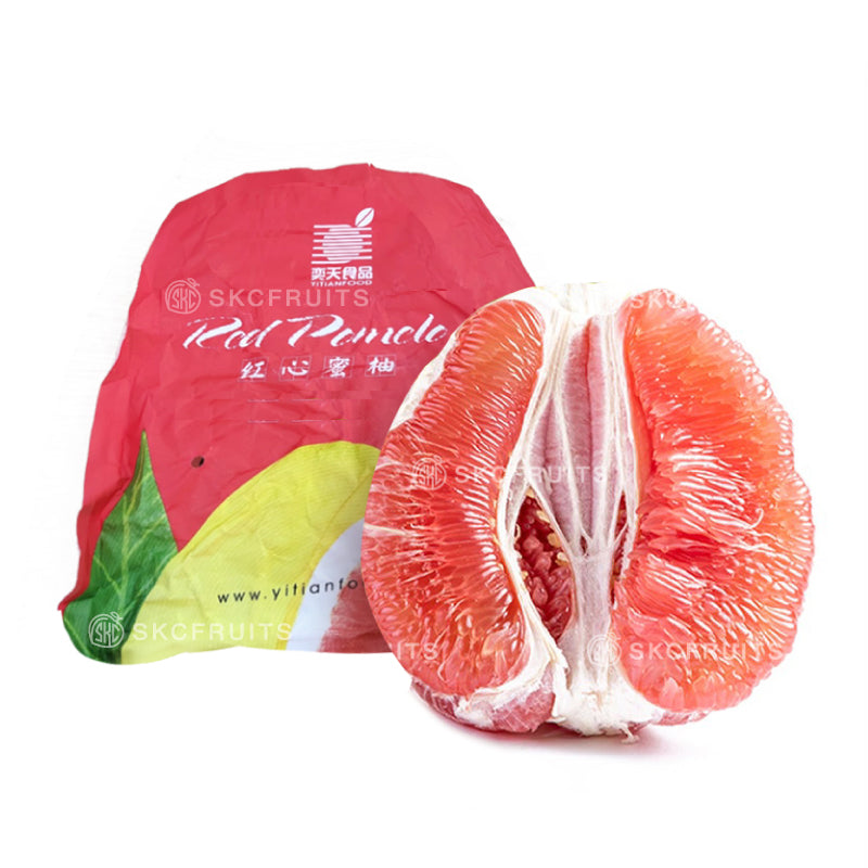 Red Honey Pomelo showing juicy pink red flesh