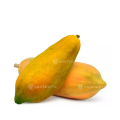 Cut open Taiwan Papaya showing orange flesh and black seeds