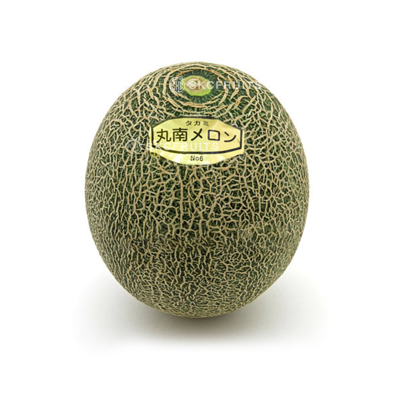 Cut open Takami melon showing juicy green muskmelon flesh