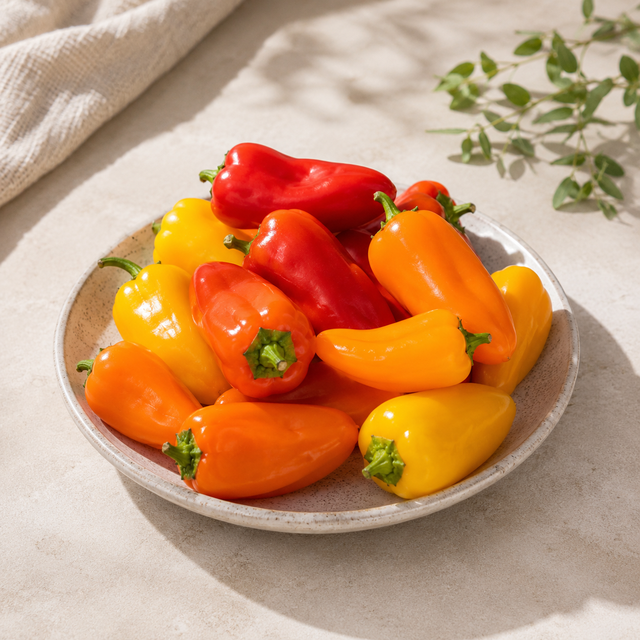 Yellow pepper and mixed mini sweet peppers for fresh serving and light cooking