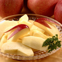 Cut Japanese Sun Fuji Apple showing crisp flesh and possible honeycore