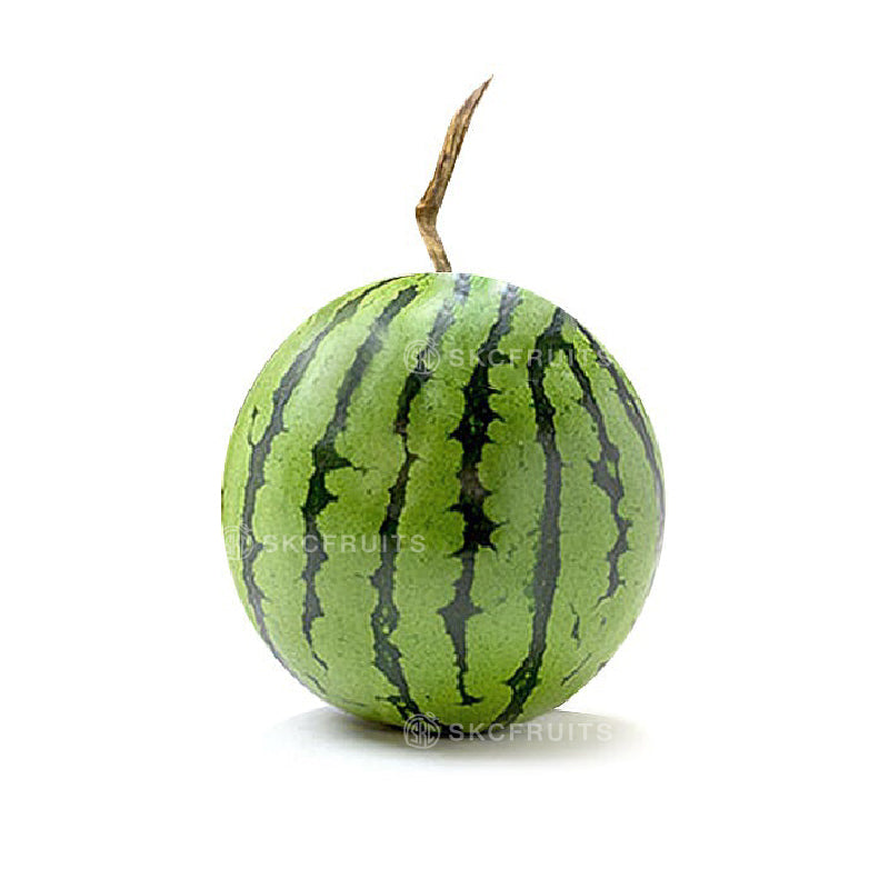 Cut open baby watermelon showing juicy red flesh and thin rind
