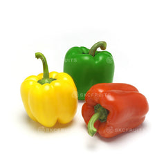  Fresh green, red and yellow capsicum arranged as a mixed colour display