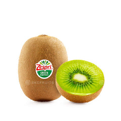 Green kiwi fruit sliced open showing emerald green flesh