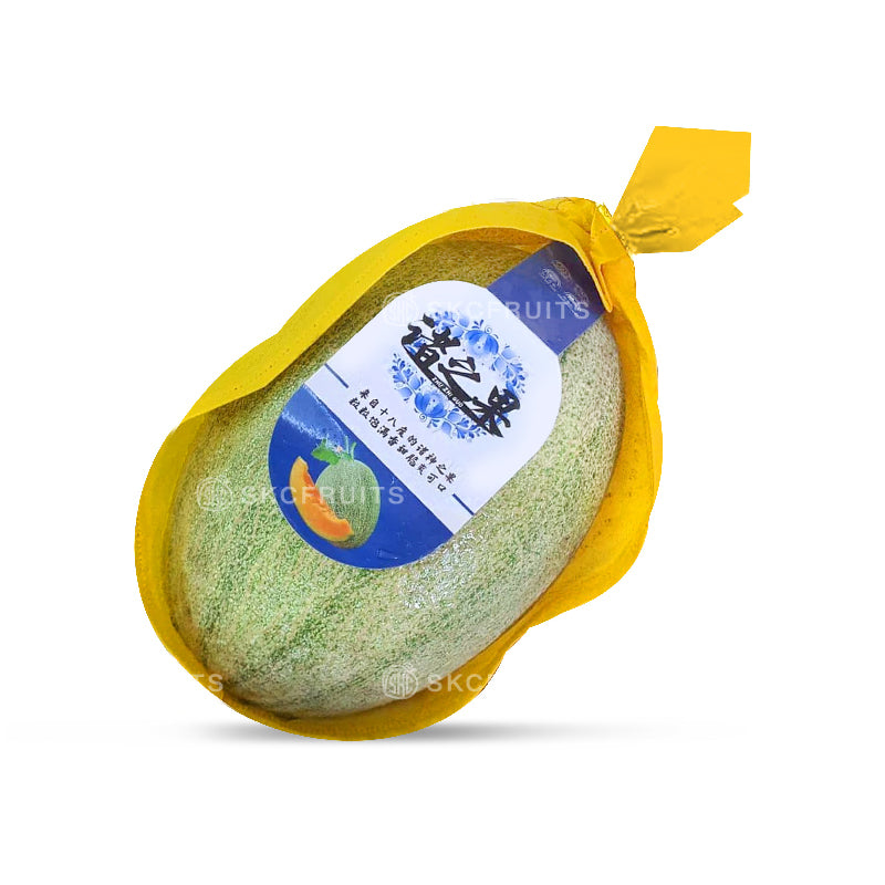 Cut open Hami melon showing crunchy juicy orange flesh