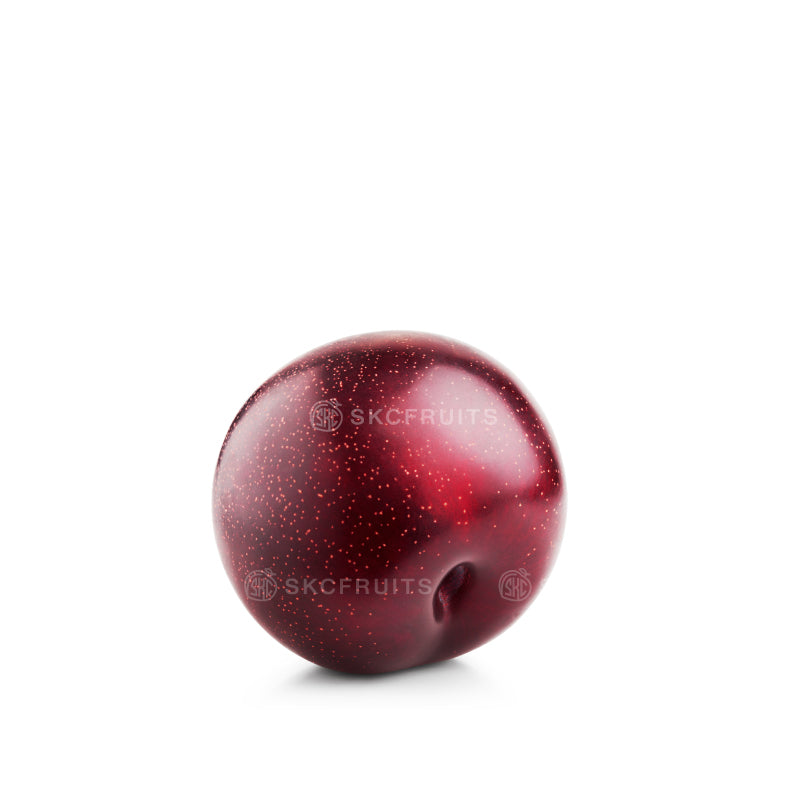 Honey Punch Plums showing juicy red crimson flesh