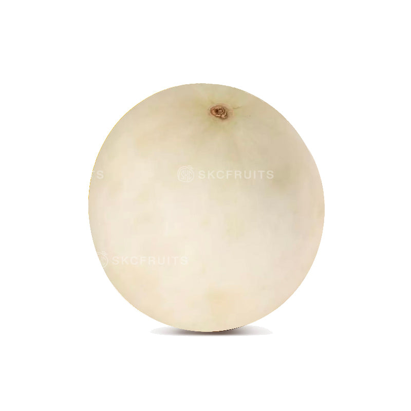 Cut open honeydew melon showing juicy pale green flesh