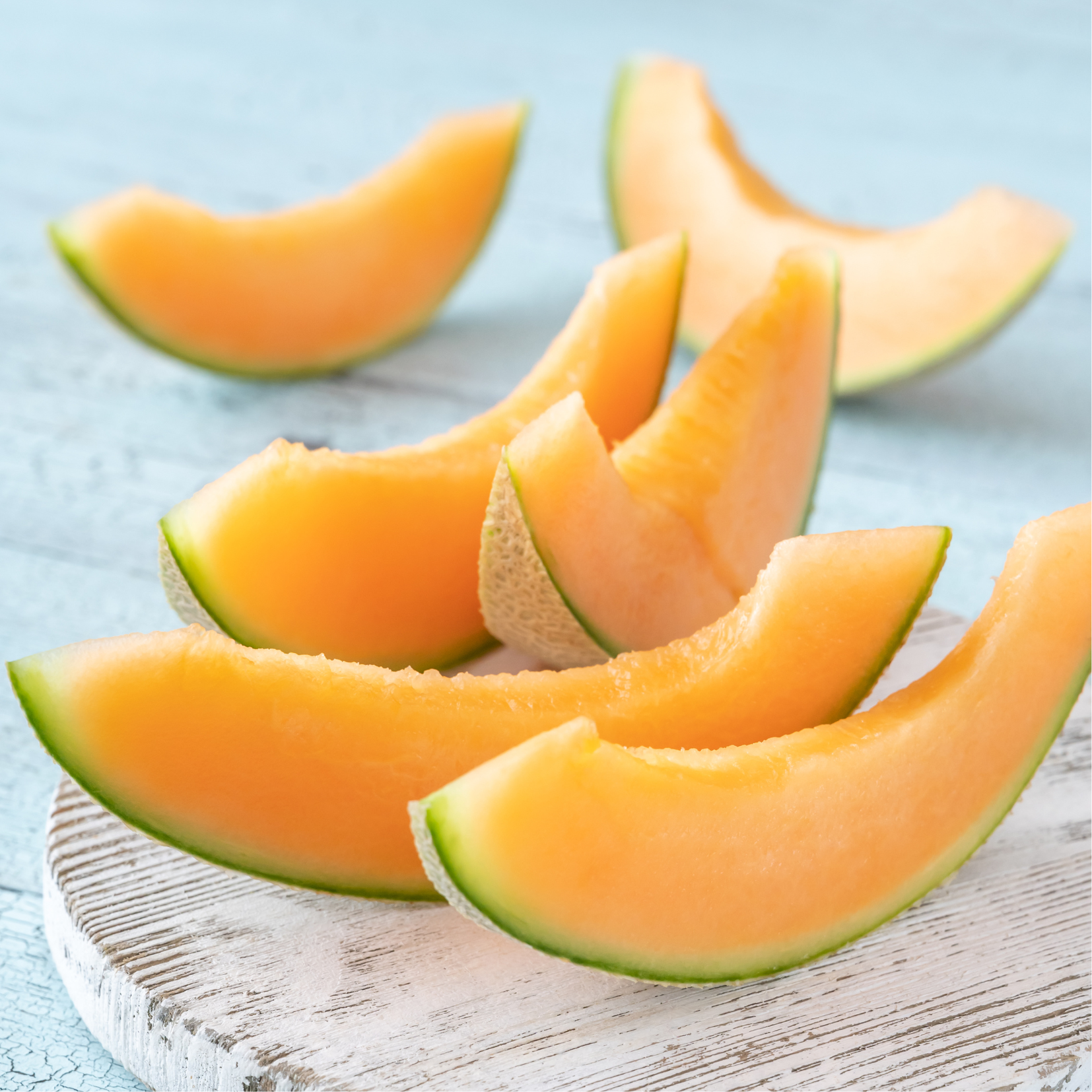 Japanese orange muskmelon cut open showing smooth orange flesh