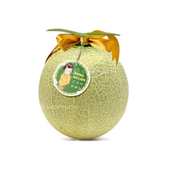 Cut open Kobe Muskmelon showing pale green flesh and seeds