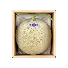 Cut open Kochi Emerald Melon showing juicy green flesh
