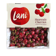 A box of Lani Heavenly Red Cherries with a clear view of the cherries inside and the brand's logo on the top.