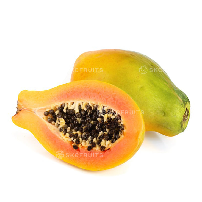 Cut open papaya showing orange-red flesh and black seeds