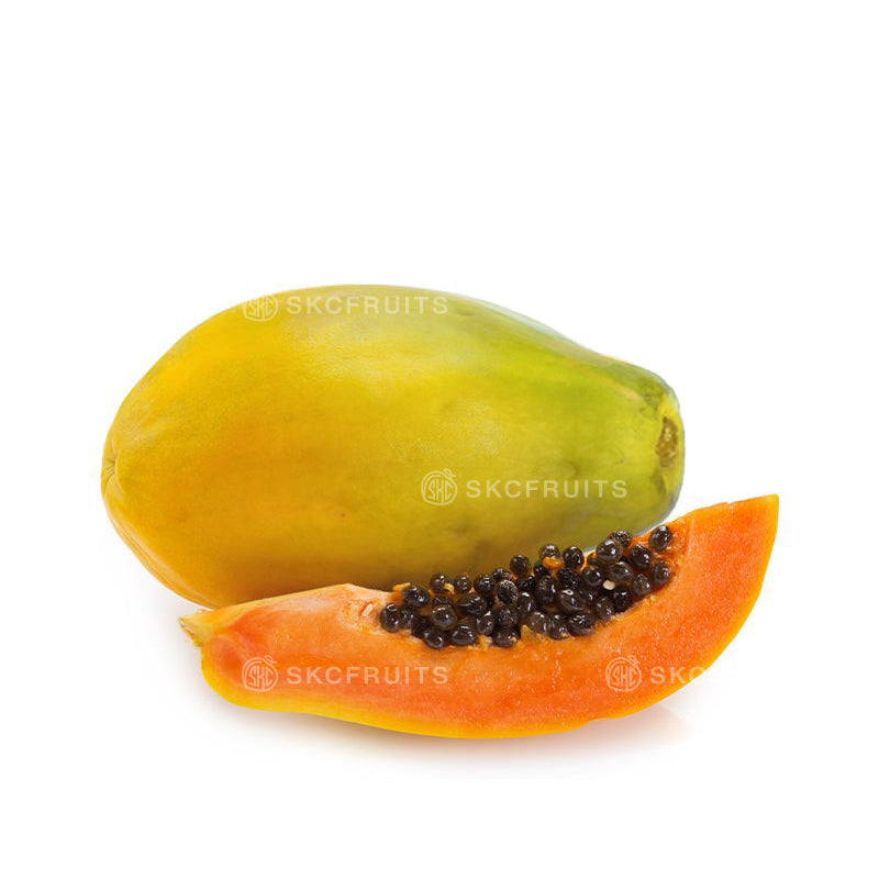 Fresh Papaya with green to yellow tropical fruit skin