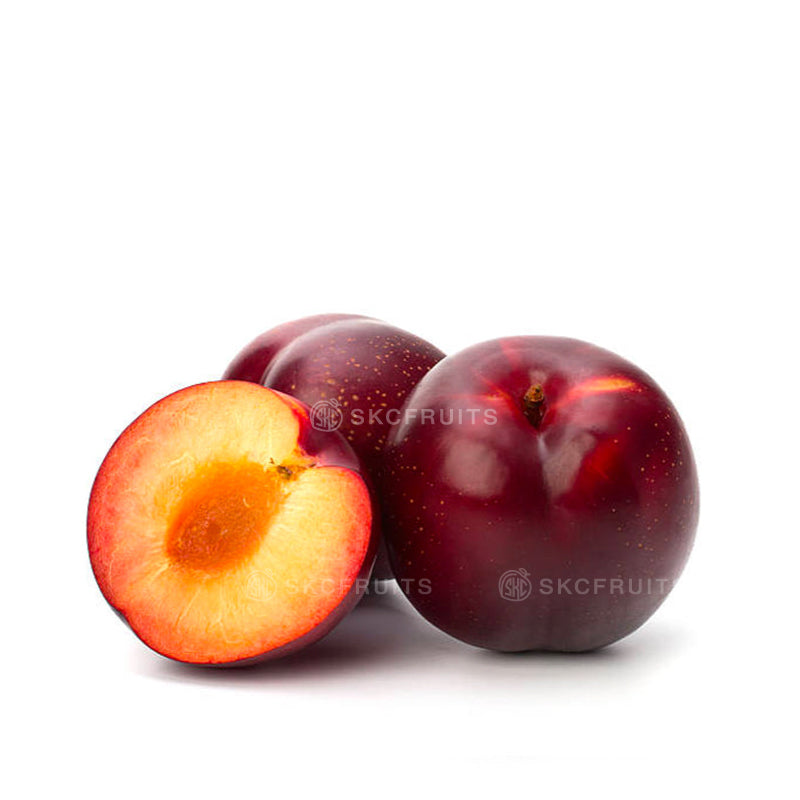 Red Honey Punch Plums with dark violet red skin