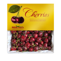 A pack of Tasmanian red cherries by Reid Fruits, displaying the cherries prominently with the brand and product name.