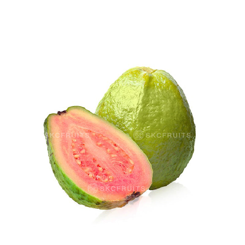 Taiwan guava sliced open showing pink guava flesh
